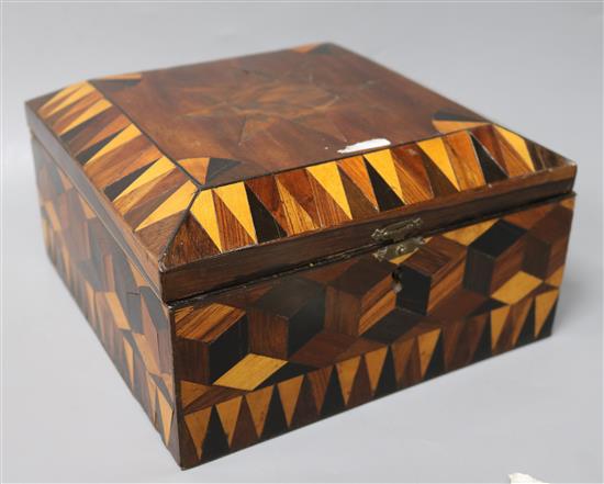 A Chinese red stained and natural carved ivory chess set, with a parquetry box